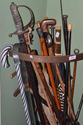 Lot 260 - Collection of assorted walking sticks, canes, umbrellas, military sword etc