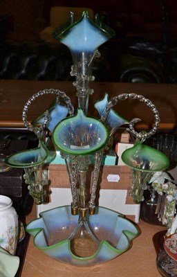 Lot 303 - A Victorian green and clear glass epergne with Vaseline rim (one arm and basket missing and central