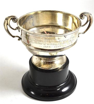 Lot 313 - A silver twin handled trophy cup on stand, Birmingham 1923