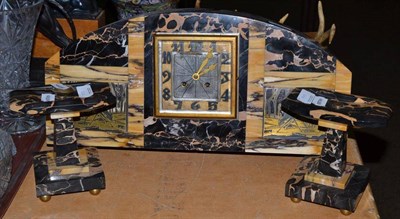 Lot 323 - An Art Deco mantel clock garniture