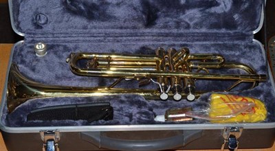 Lot 355 - A brass trumpet by Simba with faux mother-of-pearl inset keys, with accessories in a hard...