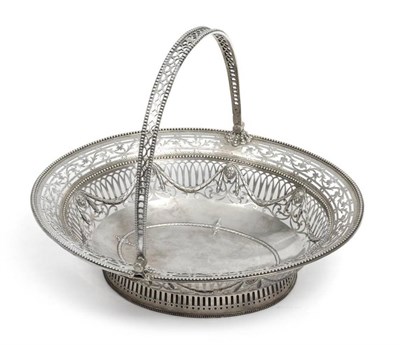 Lot 590 - A George III Silver Bread Basket, pierced out marks, London, circa 1770, oval on a pale pierced...