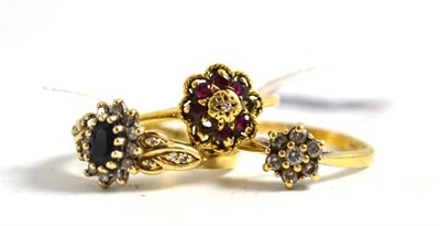 Lot 381 - A 9ct gold diamond cluster ring, a 9ct gold sapphire and diamond cluster ring and an 18ct gold...