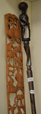 Lot 384 - Hardwood stick carved with figures and panel carved with animals (2)