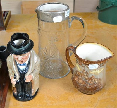 Lot 400 - A cut glass water jug with silver mounts, a Royal Doulton Winston Churchill Toby jug and a...