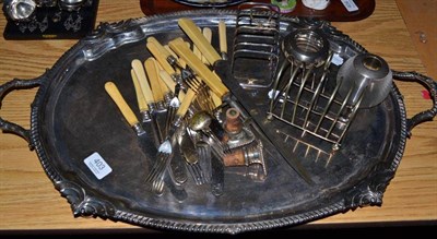 Lot 403 - A silver plated twin handled tray, match striker, two plated toast racks etc