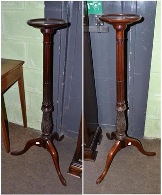 Lot 449 - A mahogany torchere and another similar (2)