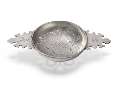 Lot 598 - A George II Silver Lemon Strainer, Gurney & Cooke, London 1731, the pierced circular bowl with twin