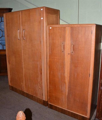 Lot 454 - A light oak wardrobe, another and a headboard