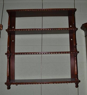 Lot 456 - Mahogany four tier wall shelves with turned supports