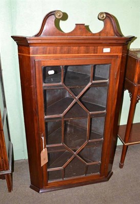 Lot 465 - A mahogany glazed corner cupboard