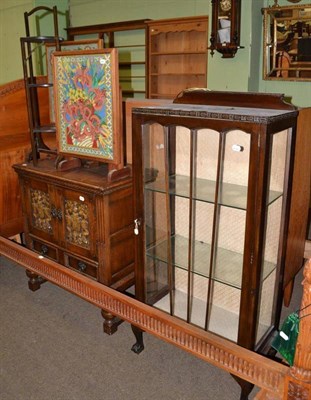 Lot 471 - A reproduction oak TV cabinet, small Edwardian glazed cabinet, two fire screens with woolwork...