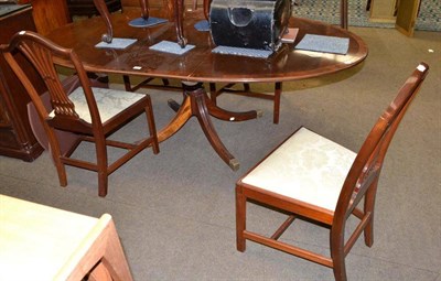 Lot 474 - Mahogany dining table, four chairs, extension leaf and table mats with table protector