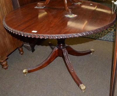 Lot 488 - Reproduction carved mahogany circular dining table