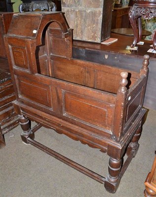 Lot 491 - A 17th century oak crib on stand