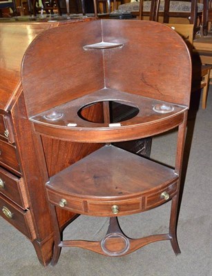 Lot 493 - A George III mahogany corner washstand