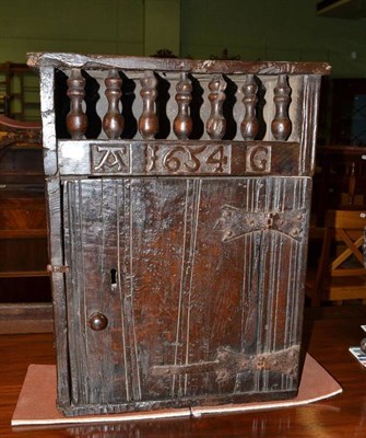 Lot 496 - An oak hanging food cupboard, initialled 'A.G', bearing date 1654