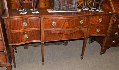 Lot 497 - George III mahogany serpentine sideboard