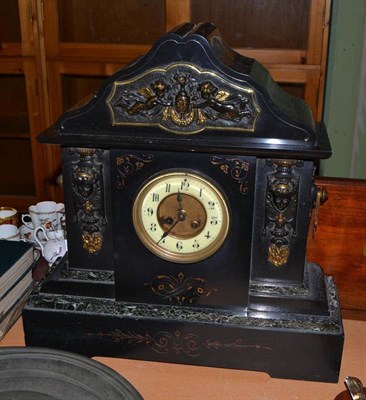 Lot 505 - A black slate and marble striking mantel clock