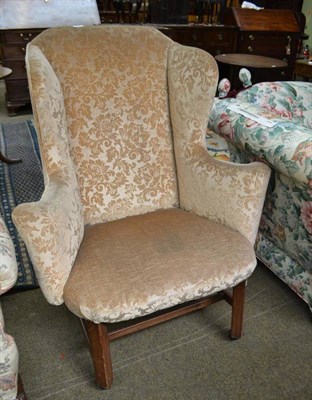 Lot 512 - Wing back armchair in George III style