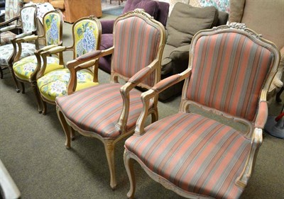 Lot 515 - A pair of modern beech framed armchairs with striped upholstery and a pair of French fauteuil style