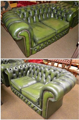 Lot 520 - Pair of green leather Chesterfield sofas