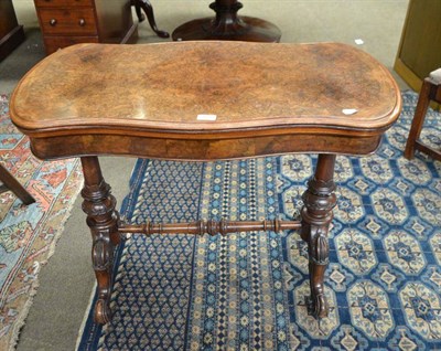 Lot 529 - Victorian walnut fold over table