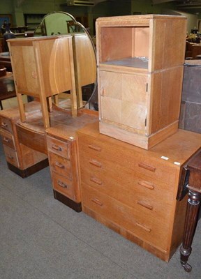 Lot 549 - An Art Deco light oak dressing table with shaped mirror, a light oak chest of drawers and two...