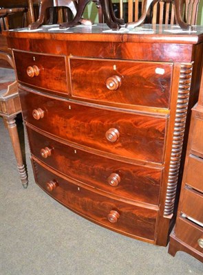 Lot 554 - A mahogany bow front chest of two short and three long graduated drawers