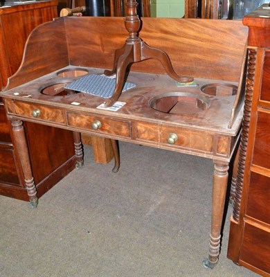 Lot 556 - A Georgian mahogany washstand with pierced gallery top