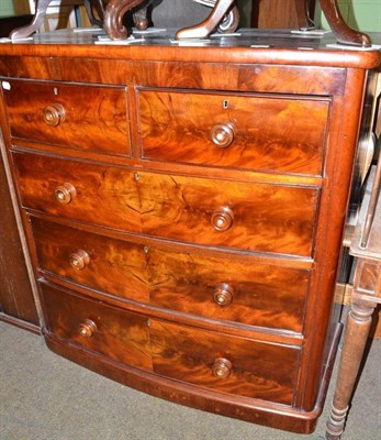 Lot 557 - A mahogany bow front chest of two short and three long graduated drawers