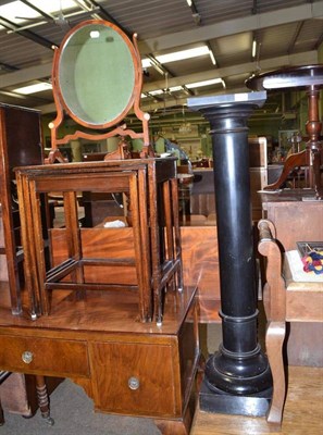 Lot 561 - An ebonised pedestal, nest of three occasional tables, toilet mirror and a carved oak hanging...