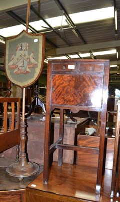 Lot 562 - A mahogany shield shaped pole screen with a woolwork insert, Trinity College, Oxford; and a...