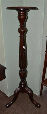 Lot 568 - Mahogany tripod torchere