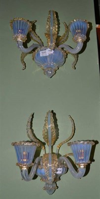 Lot 595 - A pair of two branch Venetian glass wall lights, the opalescent branches with fleckled gilt...