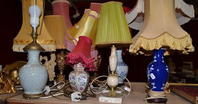 Lot 628 - Twelve decorative assorted table lamps, some with shades