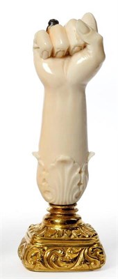 Lot 616 - A Gold Mounted Ivory Desk Seal, circa 1825, as an ivory arm, the clenched fist wearing a gold metal