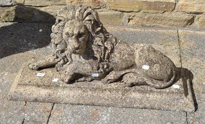 Lot 682 - A reconstituted flat back figure of a seated lion