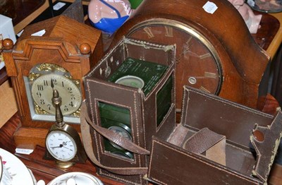 Lot 16 - A racing pigeon clock, two mantel clocks, a Swiza alarm clock, a Gothic carved oak watch holder (5)