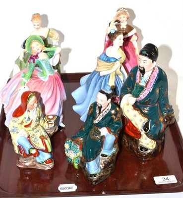Lot 34 - Four Royal Doulton figures including Autumn Breezes colourway and three Chinese porcelain figures