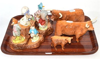 Lot 46 - Beswick Highland cattle group and five Beswick Beatrix Pottery figures on a stand