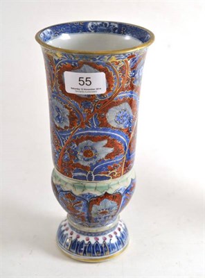 Lot 55 - A clobbered Chinese blue and white beaker