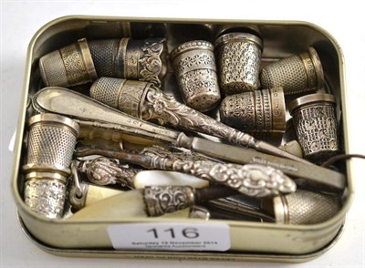 Lot 116 - Quantity of silver thimbles and small button hooks etc