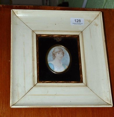 Lot 128 - Late 19th century portrait miniature of a girl in a blue and cream dress