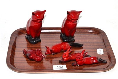 Lot 142 - Two Doulton flambe cats, fox, two rabbits and a duck