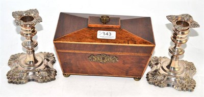Lot 143 - Mahogany tea caddy and a pair of plated dwarf candlesticks (3)