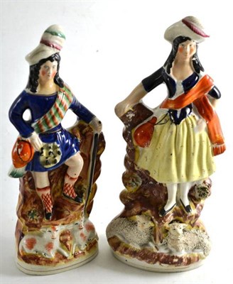 Lot 146 - A pair of 19th century Staffordshire figures of a shepherd and a shepherdess (one a.f.)