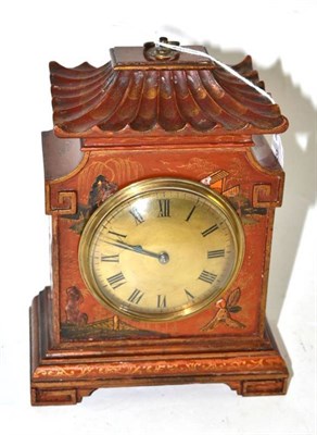 Lot 149 - A 1930's small pagoda shaped mantel clock in a japanned case
