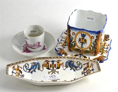 Lot 163 - An 18th century German coffee can and saucer with rose en camieu decoration; a Gien faience...