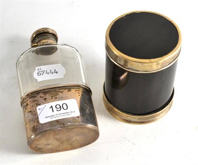 Lot 190 - Silver mounted glass hip flask and tortoiseshell cylindrical box and cover with metal mounts (2)